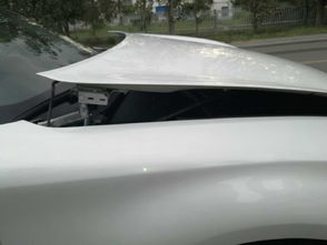 汽车前机盖咋个坑多少钱(汽车前机盖受损修复费用解析)