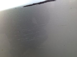 汽车刮擦露底漆了多少钱(汽车刮擦露底漆修复费用解析)